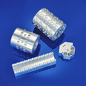 Manufacturing parts such as forming cylinders, reel holders, gearboxes for packaging machines